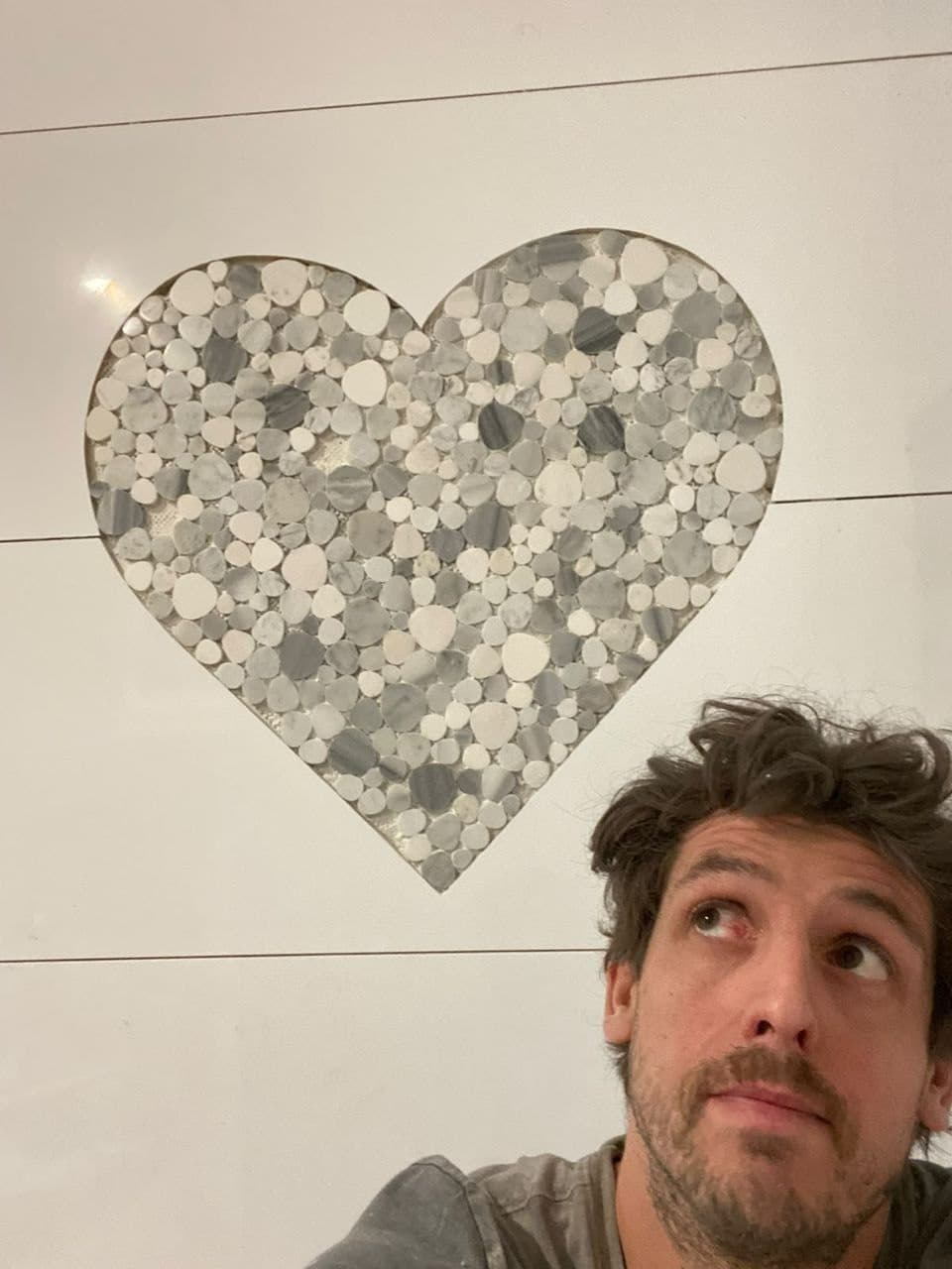 Heart Feature Wall — Pebble & marble heart inlay