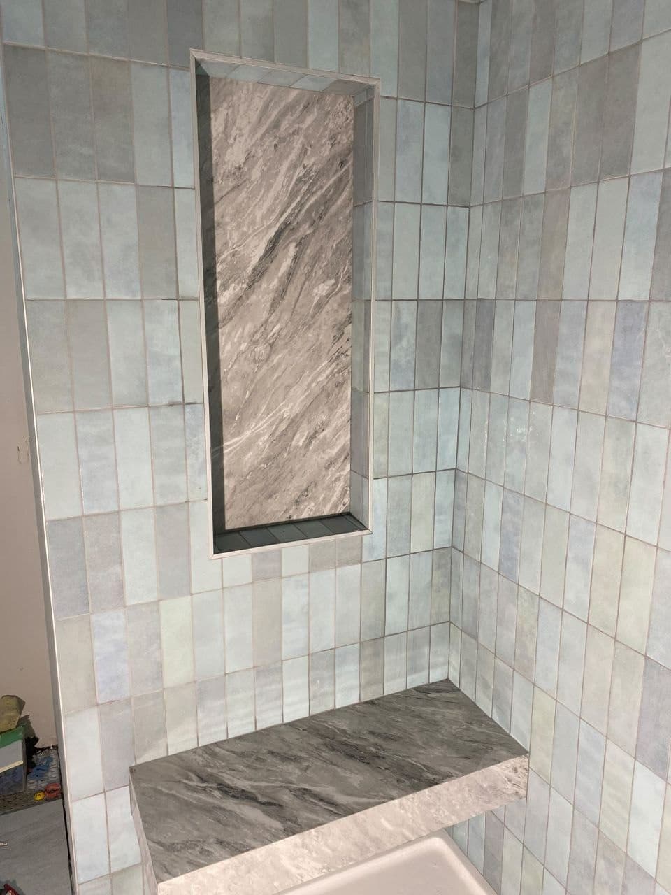 Pebble Heart Inlay — River-stone shower accent