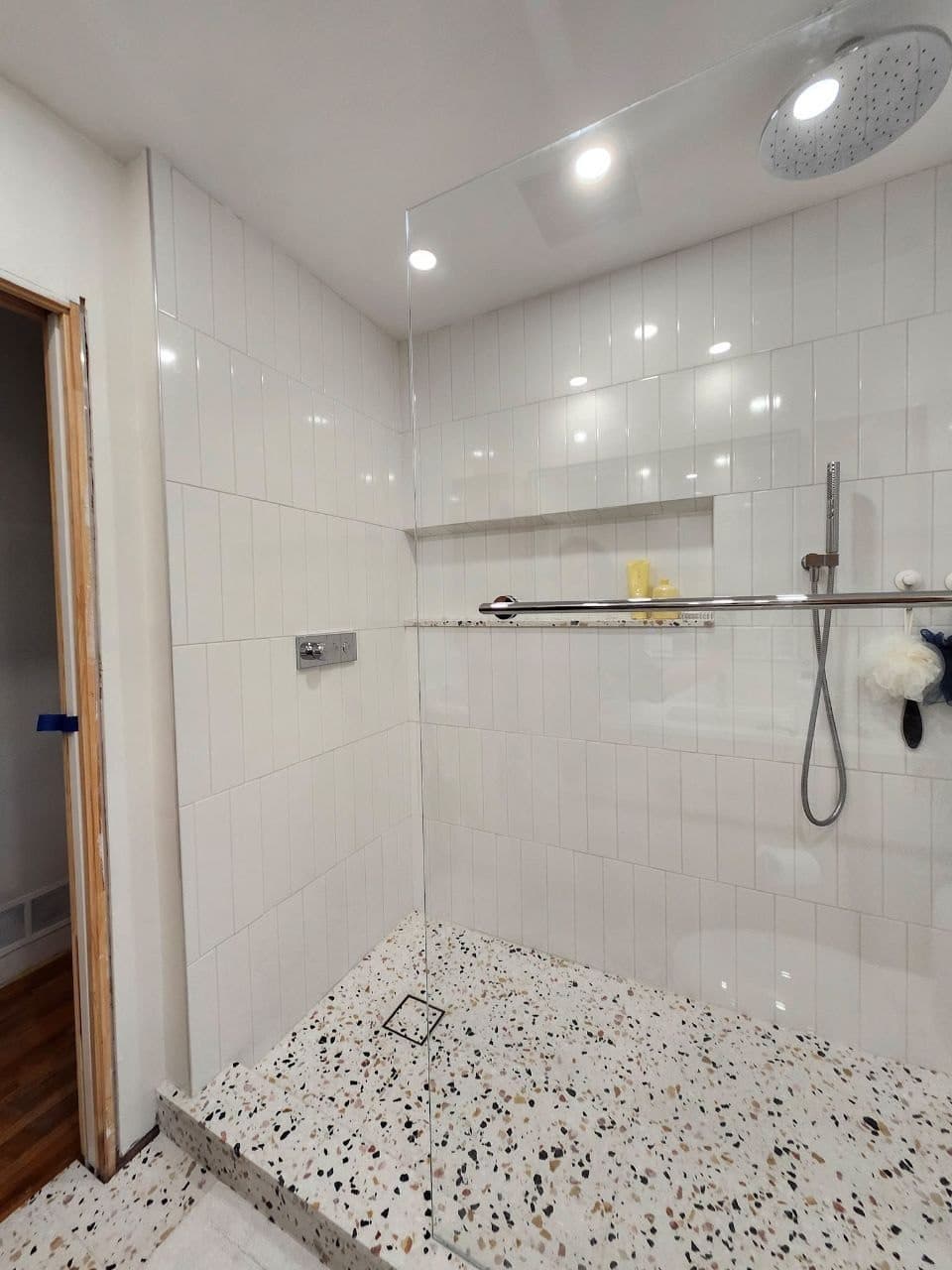Terrazzo Pan Shower — Terrazzo floor, light walls
